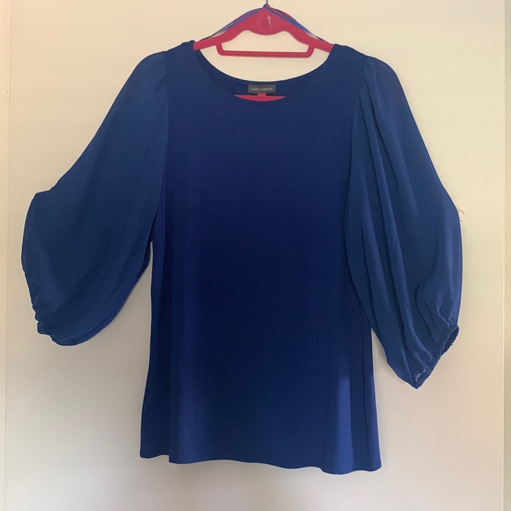 Dressy royal blue blouse with chiffon sleeves.